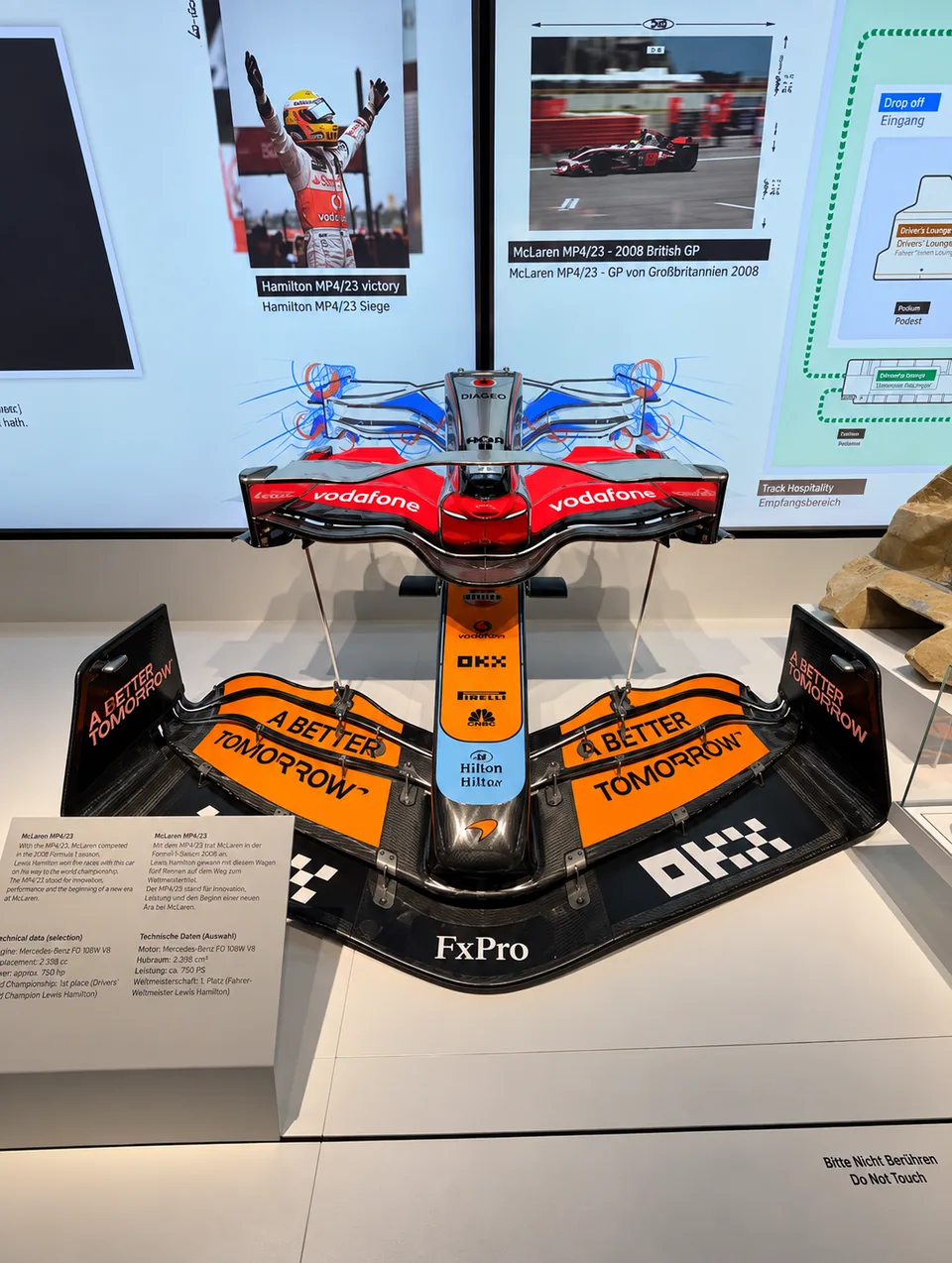 Front and rear wings of a McLaren MP4 23 displayed above each other
