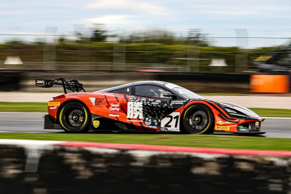 Ferrari GT race car number 21 on track
